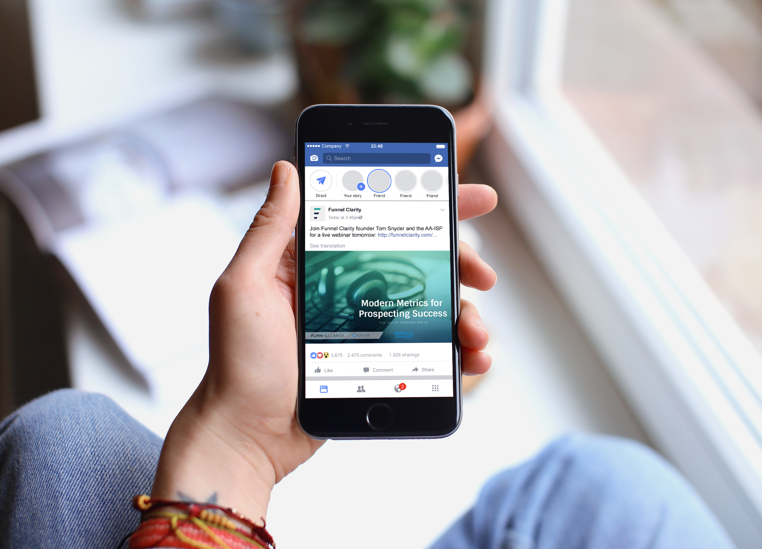 Funnel Clarity Webinar Promo on Facebook, viewed in hand on an iPhone